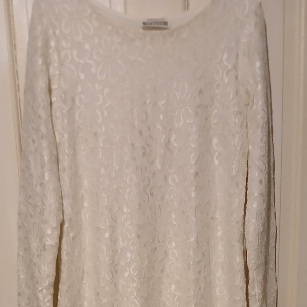Dressed in white, lace fully lined dress